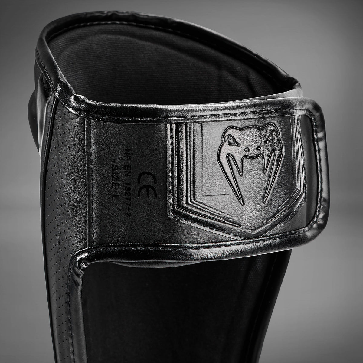 Venum Elite Evo Schienbeinschoner - Schwarz/Schwarz