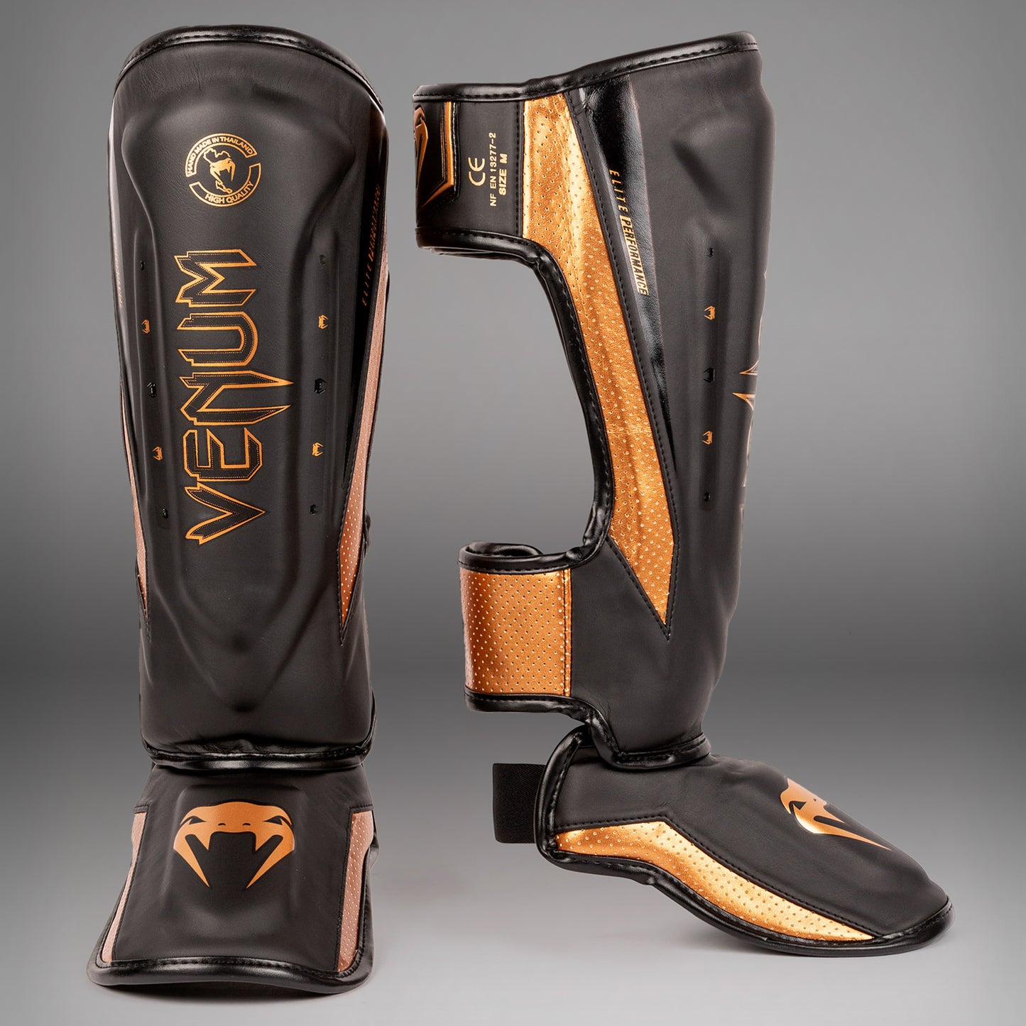 Venum Elite Evo Schienbeinschoner - Schwarz/Bronze