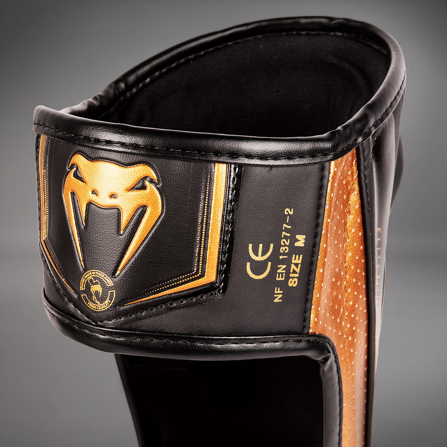 Venum Elite Evo Schienbeinschoner - Schwarz/Bronze