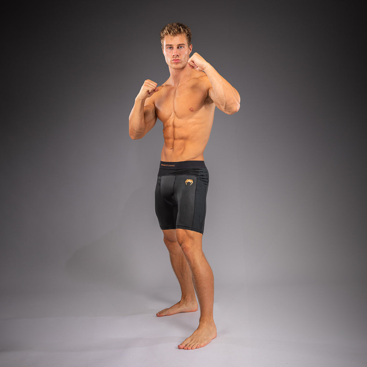 Venum G-Fit Revolution Vale-Tudo-Shorts - Schwarz/Kupfer