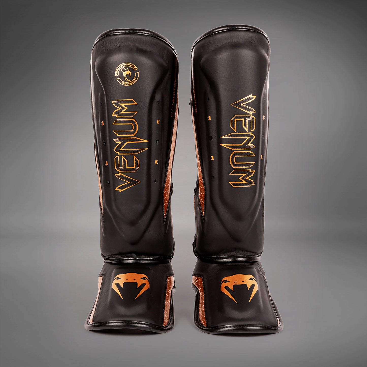 Venum Elite Evo Schienbeinschoner - Schwarz/Bronze