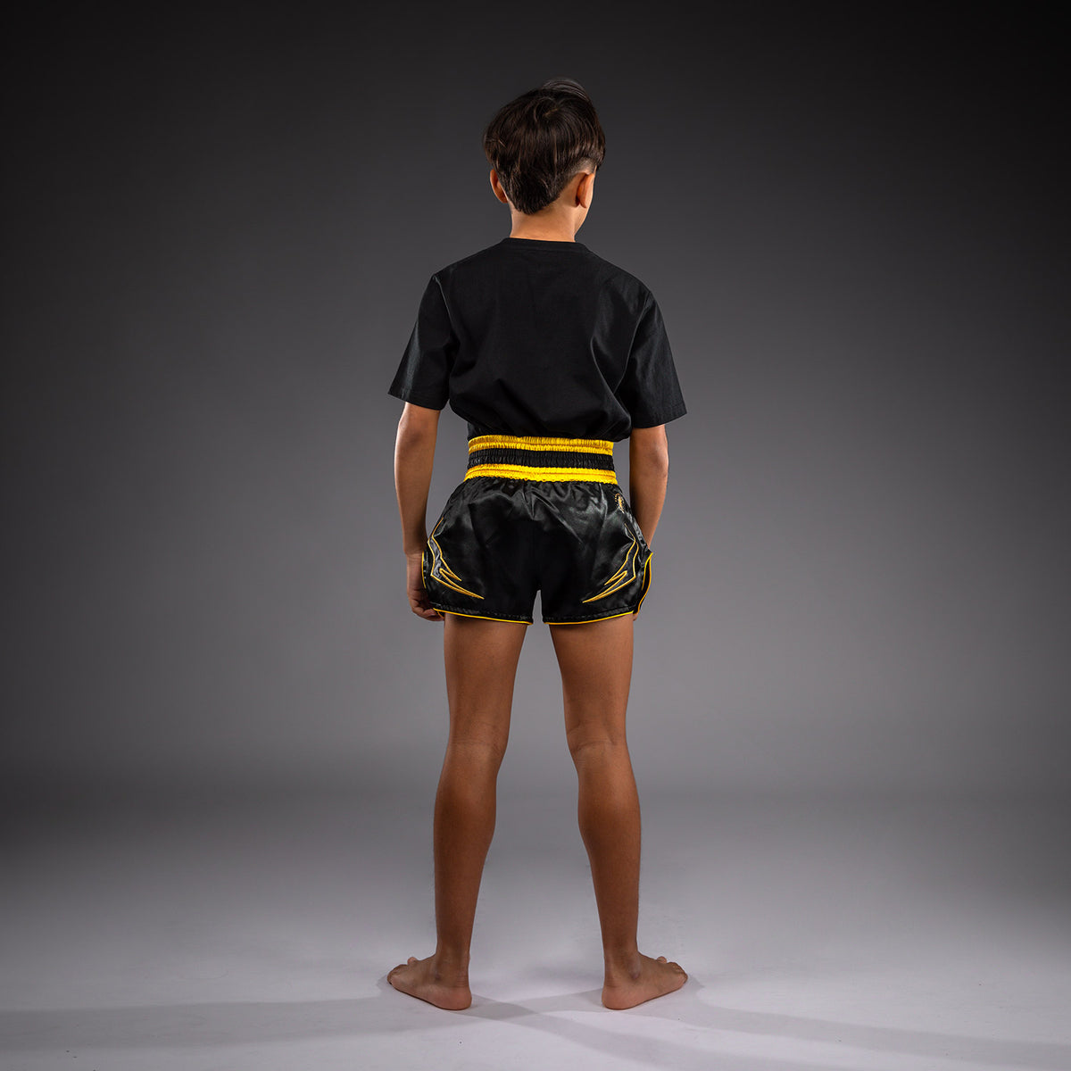 Venum Bangkok Fury Muay-Thai-Shorts für Kinder - Schwarz/Gold