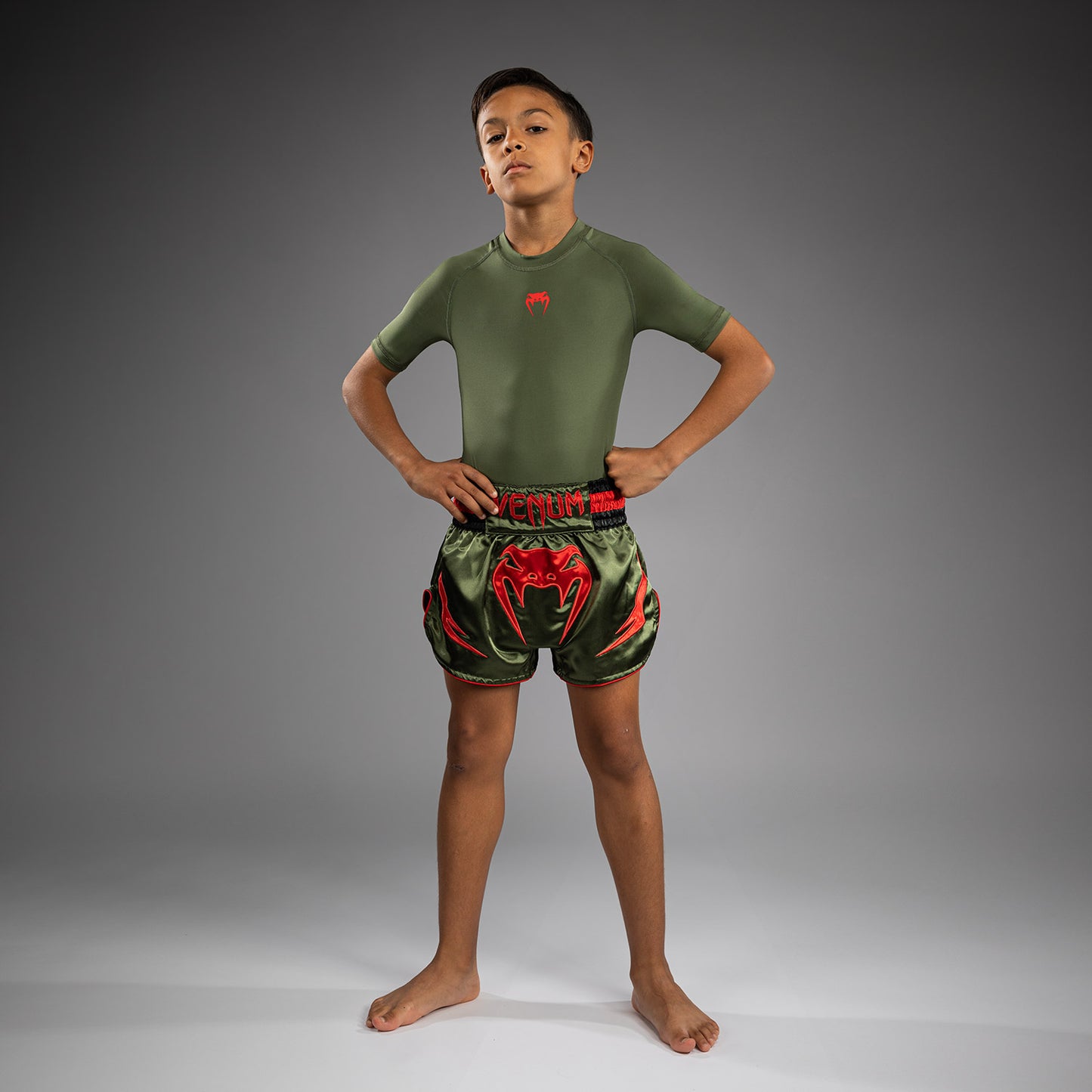 Venum Inferno Kinder Muay Thai Shorts - Armeegrün/Orange